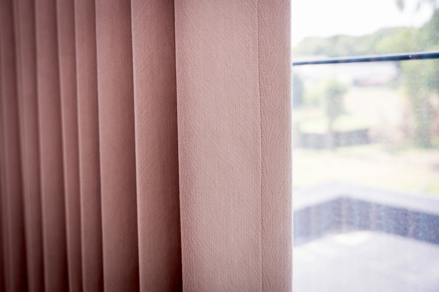 Pink curtain with floral pattern